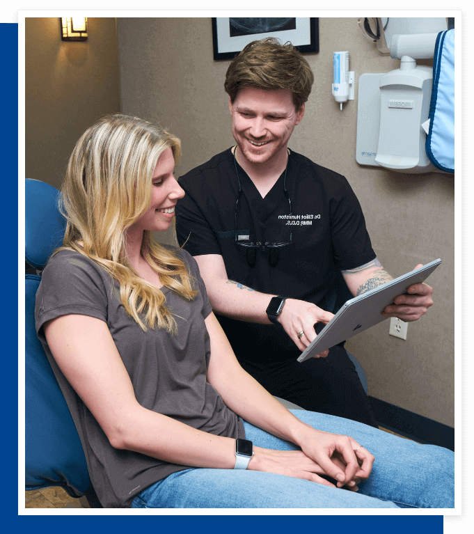 Dentist Showing Woman Oral Care Procedure